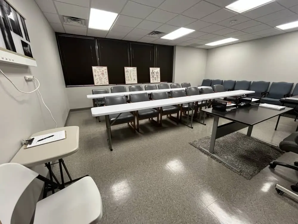 Instructor guiding students through X-ray positioning in a primaMED classroom