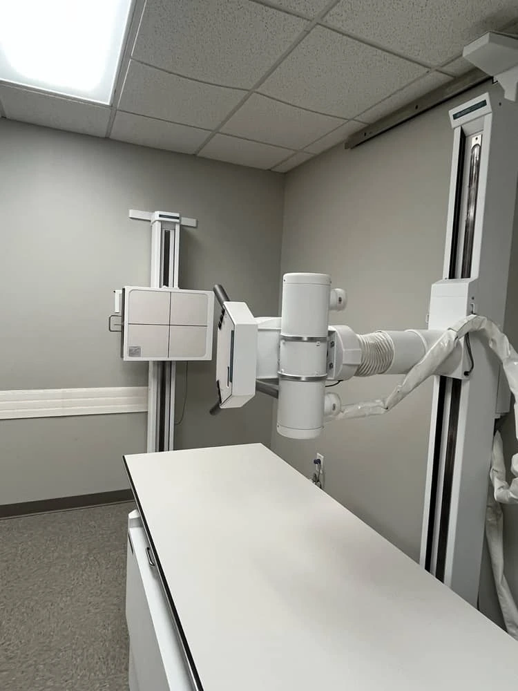 Learner preparing a digital detector plate for positioning