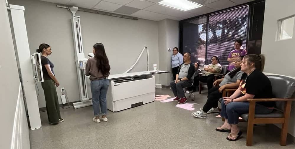 Medical professional preparing X‑ray equipment